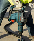 Worker using SDS Max Speed Xtreme Rotary Hammer Bit with 100% Carbide Head Four Cutter Design in reinforced concrete drilling