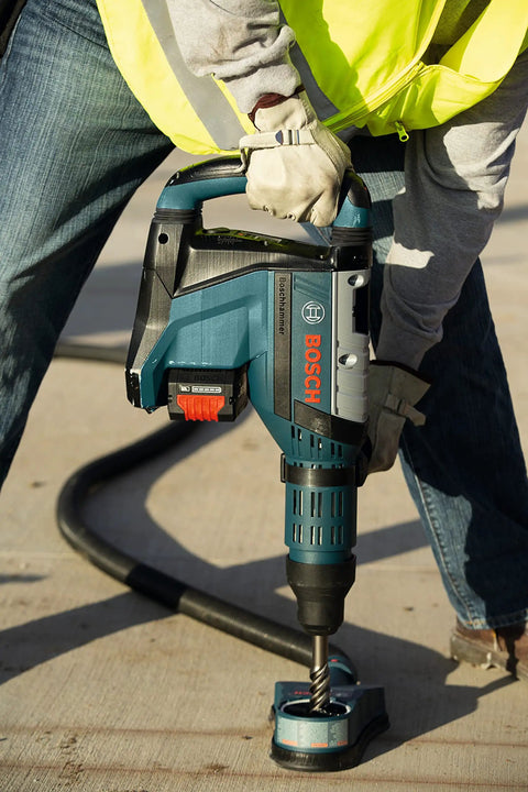 Worker using SDS Max Speed Xtreme Rotary Hammer Bit with 100% Carbide Head Four Cutter Design in reinforced concrete drilling