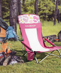 Low Seat Beach Chair With Mesh Back And Cup Holder lightweight foldable camping chair on grass beside campfire and tent