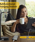 Woman using tablet next to sleek black dimmable nightstand lamp with USB ports and AC outlet, industrial metal bedside light.