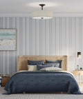 Inspire Collection Antique Bronze Three Light Semi Flush Mount Ceiling Light for bedrooms with blue bedding and striped walls