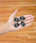 Hand holding Heavy Duty Adjustable Leveling Feet 4 Pack For Cabinets And Tables Protective Furniture Feet With Three-Eighth Inch Thread