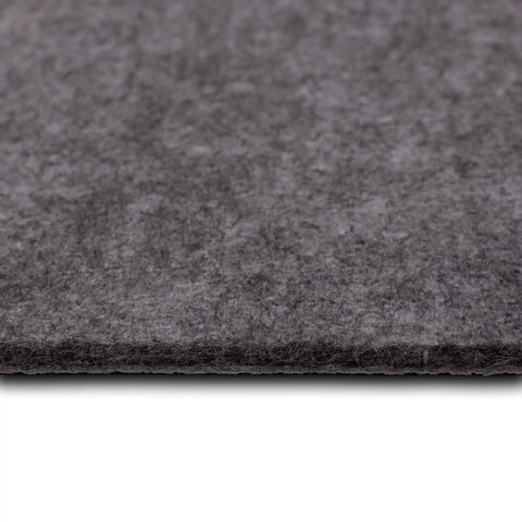 Close-up of gray felt texture of 8x10 Luxury Non Slip Rug Pad With Dual Surface Felt And Rubber Gripper One Quarter Inch Thick Cushion.
