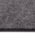 Close-up of 4x6 Premium Luxury Non Slip Rug Pad One Quarter Inch Thick Dual Surface Felt And Rubber Grippy Safe For All Floors in grey.