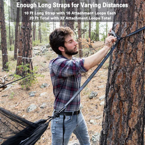 Man setting up Double Tree Hammock With Built In Net for Camping And Travel with 20 Foot Strap System in the woods