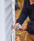 Man using Clear Silicone Caulk For Windows And Doors, 2.8 Fl Oz Tube, 1 Pack, Go To 100 Percent Waterproof Sealant on outdoor siding