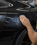 Applying All In One Car Wax Cleaner that cleans dirt grime and water spots removes light scratches and defects polishes to a slick shine