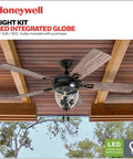Glencrest 52 Inch Indoor Outdoor LED Ceiling Fan With Light And Pull Chain, dual finish blades, mounted on wood ceiling.