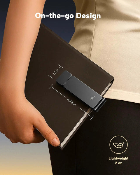 Person holding a book with a grey Rechargeable Clip-On Reading Light with 3 Color Temperatures and Stepless Dimming attached.
