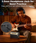 Man playing electric guitar with Portable 10W Electric Guitar Amplifier With Clean Drive Channel Pure Analog Tone USB C Rechargeable Bluetooth and 3.5mm Headphone AUX Jack Ultra Portable Practice Amp For Home Dorms And On The Go on table.