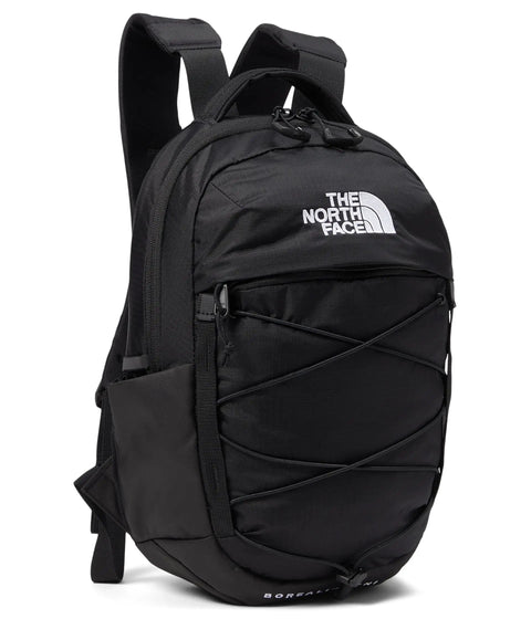 Borealis Mini Backpack, 10 Liter City Daypack with Front Bungee System, durable abrasion-resistant black construction, side angle view.