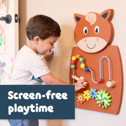Toddler playing with Horse Themed Activity Wall Panel With Two Interactive Activities For Toddlers Kiddo Friendly Montessori Sensory Busy Board Toy Safe Non Toxic Wood Ages 18 Months Plus Ideal Toddler Room Decor mounted on wall.