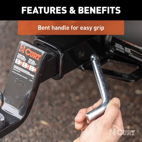 Trailer Hitch Pin And Clip With Grooved Head For Easy Installation Five Eighths Inch Diameter Fits Two Inch Receiver Ergonomic Design For Quick No Fuss Use And Durable Trailer Accessory shown in use with bent handle.