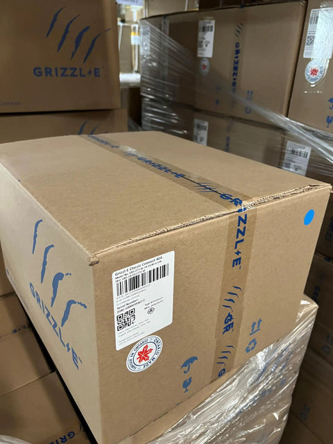 Plug And Play Smart Level 2 EV Charger 40 Amp WiFi Wall Mount cardboard box stored in warehouse, labeled with GRIZZL'E branding.