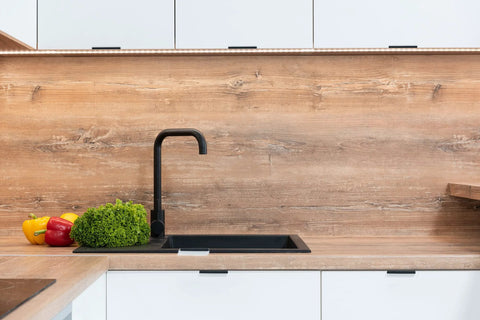 Modern kitchen with matte black faucet, wood backsplash, and cabinets featuring 6 Pack Finger Edge Pulls For Cabinets 80mm Length Matte Black.