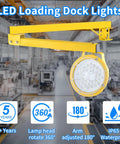Tough As Nails 30W LED Loading Dock Light With 43 Inch Swivel Arm 3300 Lumen, yellow arm and lamp head in warehouse.