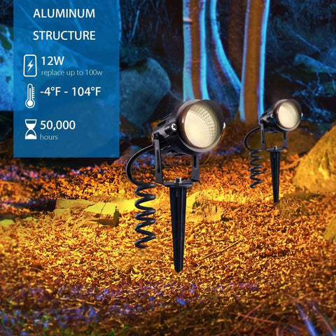 5W AC120V Landscape Up Down Spotlight With Spiked Stand And Base in a garden setting, highlighting trees with warm light