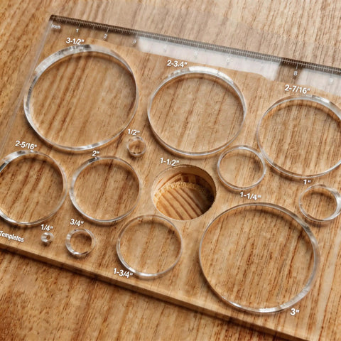 A Damn Sharp Transparent Acrylic Router Template For Woodworking Boasts Thirteen Circle Sizes Packed In A Single Piece on wood surface.