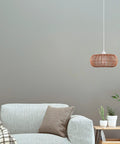 Fitz 1-Light Pendant Light With Blonde Rattan Shade And White Socket, Plug-In Or Hardwire Ceiling Mount in cozy living space.