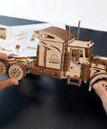 Heavy Truck 3D Wooden Puzzle Kit For Adults No Glue Needed No Tools Required Eco Friendly Plywood Brain Teaser Hobby Set For Model Builders And Home Decor assembled wooden truck model in hands