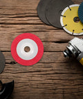 Top Notch Nylon Abrasive Wheel For Metal Wood Grinding Buffing Disc placed on wooden surface with other discs.