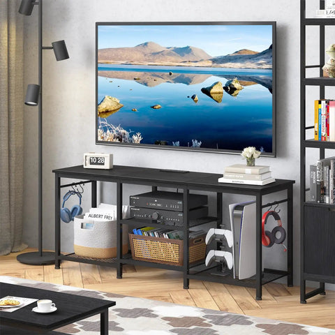 TV Stand For Televisions Up To 55 Inch With Built In Power Outlet And USB Ports Type C Port Open Storage Shelves Black Entertainment Console Table For Living Room And Bedroom Slick Cable Management in a modern living room setup with devices and decor.
