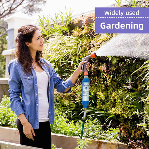 Woman using Heavy Duty Inline RV Water Filter With Hose Protector Quick Twist Fit Clears Chlorine Sediment And Rust From Your Tap Makes Campground Runs A Breeze In Blue for gardening.