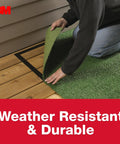 Person applying Heavy Duty Double Sided Rug Tape That Grips And Keeps Rugs From Sliding In High Traffic Areas Indoors Or Outdoors