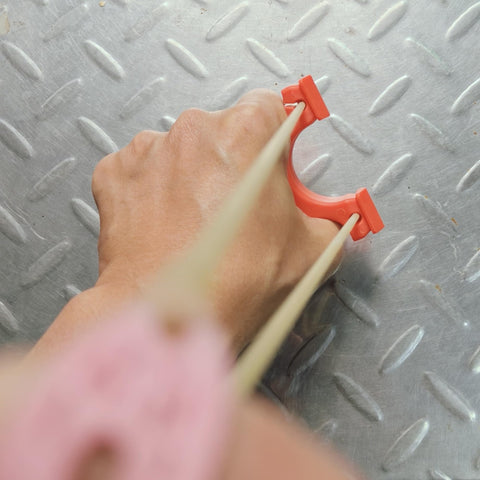 Ultra Compact Mini Slingshot With Flat And Round Bands In Red Nylon Fiber, Ambidextrous And Pocket Sized For On The Go held in hand