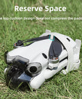 DJI Mini 4 Pro Propeller Guard Strap Holder in use with drone on grass, showcasing secure propeller protection