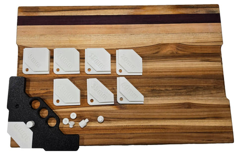 Professional Router Template And Corner Jig For Fine Trim Work Features Precision Chamfer Cutting Guide with interchangeable inserts on a wooden work surface.