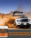 Multi-Purpose White Lithium Grease tub with orange label, 3.52 oz, beside a white off-road SUV in desert dust.