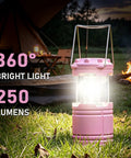 2 Pack Mini LED Pink Camping Lanterns Portable Outdoor Handheld Lights for Camping Hiking Power Outages and Emergencies Durable ABS Construction for Long Lasting Use lighting up campsite with tent and fire in background