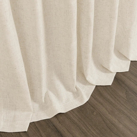 Close-up of Birch Beige Linen Curtains 84 Inches Long Light Filtering Semi Sheer Back Tab Drapes grazing hardwood floor.