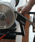 Total No Sweat Setup For Your Shop This Upgraded Grinding Jig System Cranks Out Razor Sharp Edges On Wood Chisels Turning Tools And Bowl Gouges Using Standard Eight Inch Grinders shown sharpening a tool.