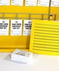Interior of Lockout Tagout Cabinet Kit with tags and labels, double wide yellow for safe padlock storage, meets OSHA standards.