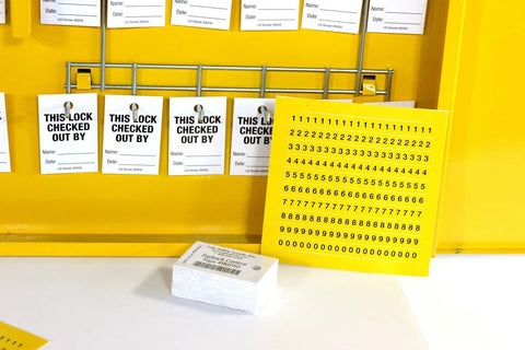 Interior of Lockout Tagout Cabinet Kit with tags and labels, double wide yellow for safe padlock storage, meets OSHA standards.
