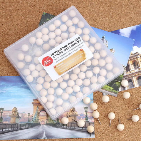 Top Shelf Wooden Push Pins, 120 Pack Of Straightforward Thumb Tacks For Corkboards And Bulletin Boards in a clear container on a corkboard.