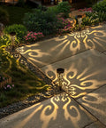 Solar Powered Fire Totem Style Outdoor Garden Lights Six Pack Waterproof Conical Stakes illuminating pathway at night