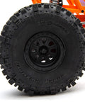 Close-up of RBX10 Ryft 4WD Brushless RC Rock Bouncer Ready To Run Beast On The Trail With Solid Front And Rear Axles wheel