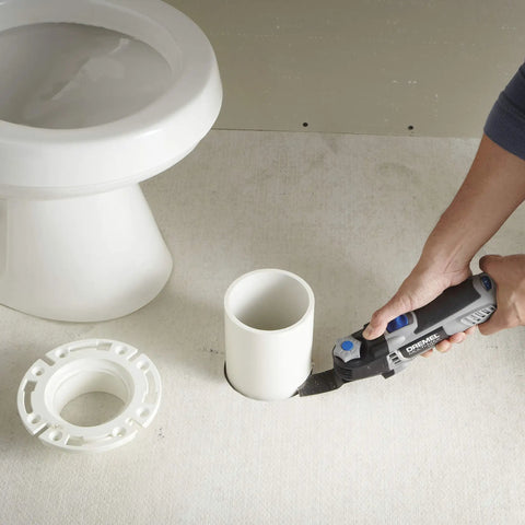 Using Corded 120V 5 Amp Multi Max Oscillating Tool Kit With Accessories for precise cuts around pipe in tight bathroom space.
