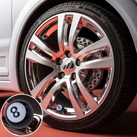 Close-up of 8 Ball Pool Style Tire Valve Stem Caps 4 Pack Universal Copper Core Dustproof Caps on car wheel, black ABS plastic.