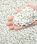 Hand holding Eight Pound Ceramic Tumbling Media Cylinders, Reusable Non Abrasive Pellets 1/5 x 2/5 Inch for Lapidary Tumblers
