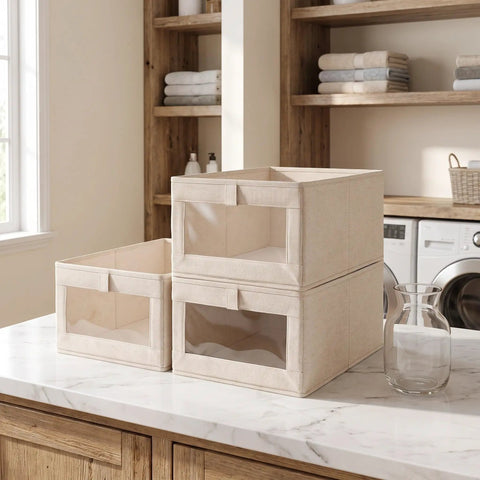Foldable Linen Closet Organizer Bins Featuring Clear Window And Reinforced Handles Super Slick Cotton Fabric Storage Cubes on a kitchen countertop.