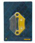 Front view of yellow TrailD Polaris ceramic brake pad on blue packaging.