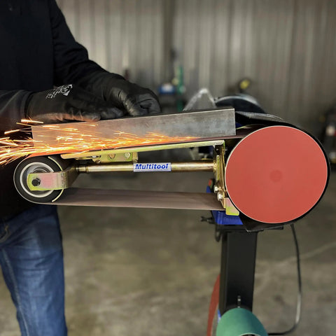 Real Badass 1HP Belt Grinder With Quick Swap 4By48 Inch Belt Auto Tension Rig And 4970 Sfpm Power cutting metal with sparks flying.