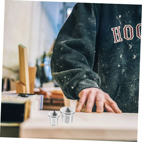Pro Grade Dowel Centering Pins For Woodworking Center Transfer Plugs in use on a wooden plank for precise hole alignment.