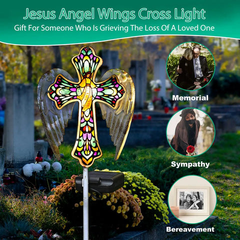 Solar Glass Cross Garden Stake Light with Angel Wings and Stained Glass Look in cemetery setting for memorial decor.