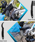 Bike Chain Cleaning Kit With Biodegradable Degreaser, Chain Lube, Cleaning Brush, Gear Gloves And Towel For MTB Road Trail And E Bike Maintenance showing gear brush and hook in use on bike gears.