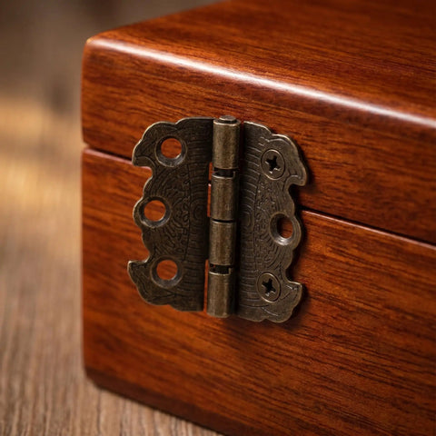 Close-up of vintage bronze mini butterfly hinge on a wooden box from 20 Pack Mini Butterfly Hinges In Vintage Bronze, 90 Degree Folding Hardware